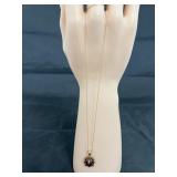 10K necklace 2.9 gr w/garnet & ??