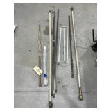 Pile of Assorted Curtain Rods
