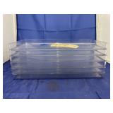 Stack of Clear Plastic Trays