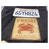 California License Plate & Fresh Seafood Sign