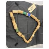 String of Wood Thread Spools