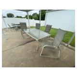 Glass Topped Patio Table w/4 Adjustable Chairs