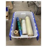 Rolls of Furniture Shrink Wrap in Plastic Bin