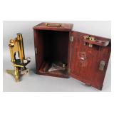 Antique all brass microscope with case
