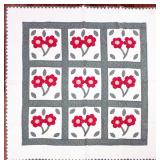 Antique appliqued bed quilt