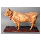 W.E.  antique cow pull toy