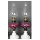 Pair of antique cranberry glass oil table lamps