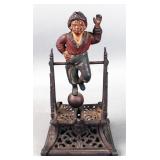 W.E. ? Antique cast iron mechanical coin bank