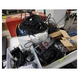 Lot of power supplies, video cables, USB cables,