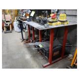 Welding bench with lot of assorted scrap metal