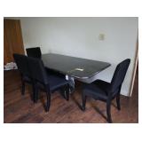 Black granite style table with four chairs