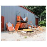 Lot of traffic signs in yard and inside the