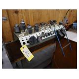 Lot of chucks, collets, chuck keys with holder