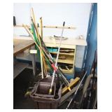 Lot of cleaning brooms, mop, dust pans, vacuum