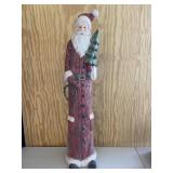 Tall Slender Santa Claus Holding Tree Decoration