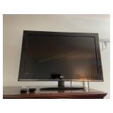 LG Flatscreen TV with Remote In Bedroom