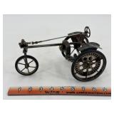 folk art wire sculpture of a tricycle