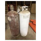 2- 100# LP tanks white one is 1/2 full