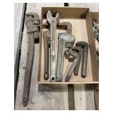 Various pipe, wrenches and parts
