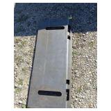 Skidloader plate sloted