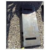 Sloted skidloader plate