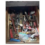 Pipe wrench and tools drawer content