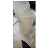 Assorted Kitchen Utensils Including Measuring Cups