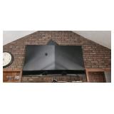 Flat Screen Television Mounted on Brick Wall