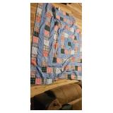 Patchwork Patterned Quilt With Visible Tear
