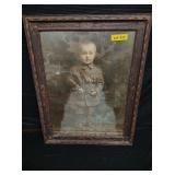 German child in military dress (water stain)