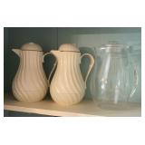 Two White Swirl Pitchers With Clear Pitcher