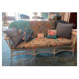 White Wicker Settee With Floral Upholstery