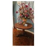 Round Wooden Table with Decorative Arrangement