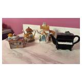 4 small teapots