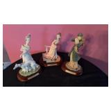 3 lady figures