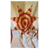 Hand stitched orange star quilt
