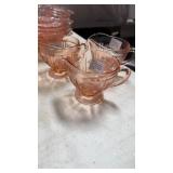 Pink depression creamers (3)