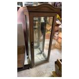 Glass cabinet missing shelves and a piece of