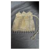 Silver mesh drawstring purse 6x6ï¿½ missing one