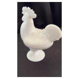 Rooster on nest