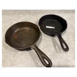 2 small iron skillets