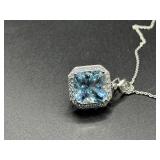 A Platinum, Aquamarine, and Diamond Halo Pendant Necklace