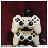 Pair Of Playstation 3 Controllers & Charging Dock
