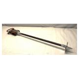 shooting stick features a brown leather seat