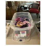 19 quart toat full of plastic bracelets