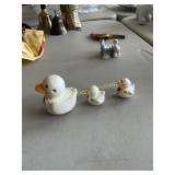 Vintage duck pulling two ducklings