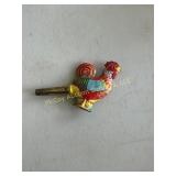 Vintage tin rooster whistle.