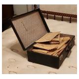 Black Suitcase with Historical Newspapers