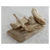Interesting ivory carving depicting a hawk catchin