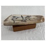 Beautiful colored scrimshaw of a flock of geese ca